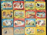 a lot of children ' s books that are on the table