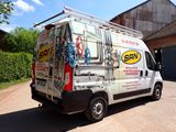 a van that is parked on the side of the road