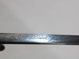 a close up of a metal object with writing on it