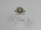 a white gold ring with a round brilliant cut diamond