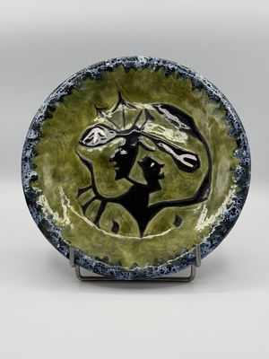 a picture of a ceramic plate with a horse on it
