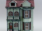 a doll house that is sitting on a table