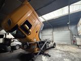 a large truck that is parked in a garage