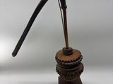 an image of a wooden pipe holder with a pipe sticking out of it ' s mouth