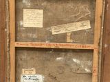 an old picture of a wooden frame with a piece of paper taped to it