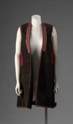 an image of a mannequin wearing a brown vest with red trims