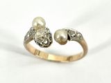 an image of a close up of a ring with pearls on it