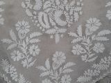 a close up of a woman ' s dress with a lace pattern on it