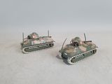 two toy tanks sitting side by side on a white surface