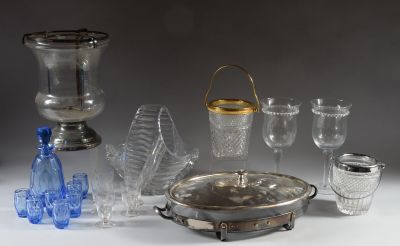 a silver tray with glasses and a silver tray with a silver lid