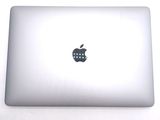 a white apple laptop with an apple logo on the screen