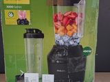 packaging of a blender sitting on top of a wooden table