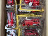 a box full of red toy fire trucks in it
