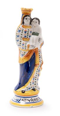 a close up of a figurine of a woman holding a child