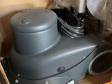 a box with a vacuum cleaner and other items in it