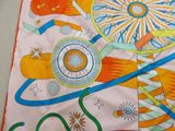 a colorful scarf with a design on it on a table