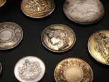 a lot of coins that are on the table