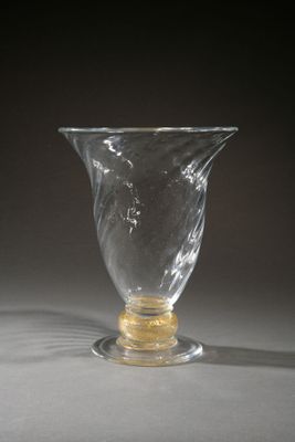a glass vase that is sitting on a table