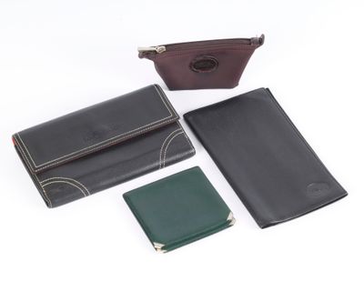 three different types of leather wallets and a wallet case