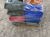 a pile of plastic boxes sitting on the ground