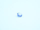 an image of a blue ring sitting on top of a snow covered ground