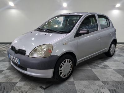 a picture of a silver car parked in a garage
