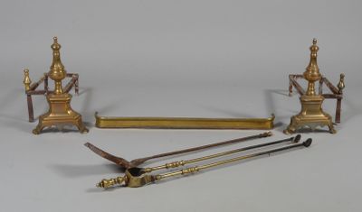four different types of brass objects on a white surface
