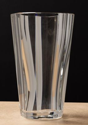 a glass with a toothbrush in it on a table
