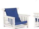 pair of white wooden chairs with a blue cover on them