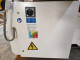 a machine that is sitting on the floor in the room
