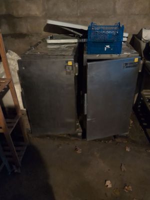 a lot of old appliances in the basement of a house