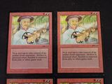 four cards of a card game with a picture of a woman holding a guitar