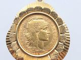 an image of a gold coin with a woman ' s face on it