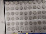 a picture of a display case with a lot of silver coins