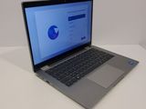 an open laptop computer sitting on top of a white table