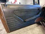 an image of a door of a car in a garage