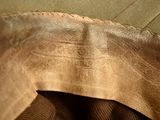 a close up of a piece of leather on a couch