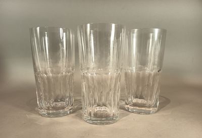 three glasses sitting on a table next to each other