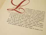 an open book with a picture of the letter l on it