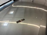 a remote control on the hood of a car