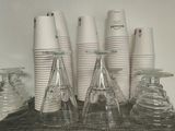 a lot of cups that are sitting on a table
