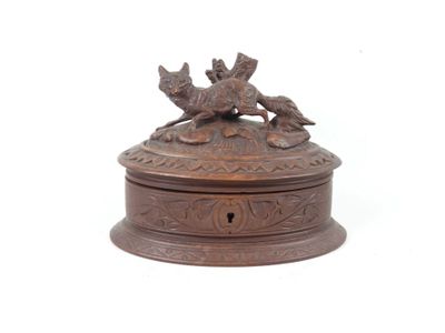 an image of a bronze box with a dog and cat on it