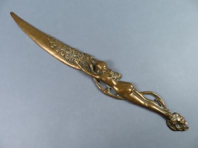 brass plated knife with a lady holding a flower