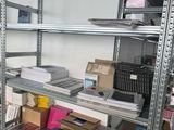 many boxes and boxes on the shelves in the room