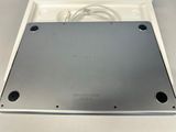 an open box with a laptop inside of it on a table