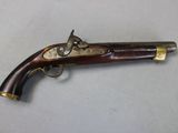 an old gun that is on display on a table