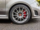a close up of a car ' s wheel on the road