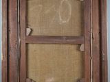 an old wooden frame with a picture of a cat in it
