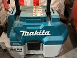 a blue and white machine that is sitting on the floor