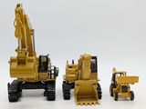 three toy vehicles that are sitting next to each other